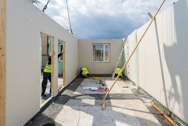 modular home being built by workers