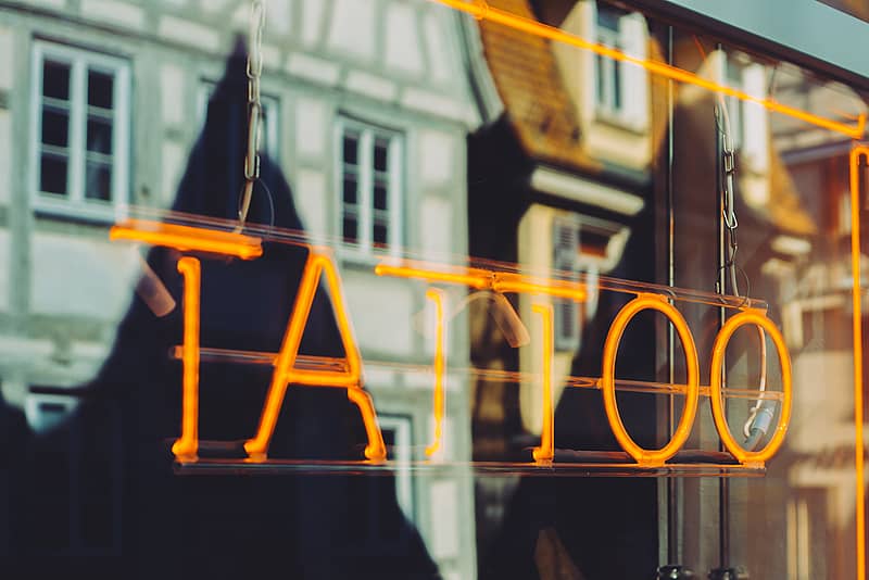 Tattoo shop with neon sign display
