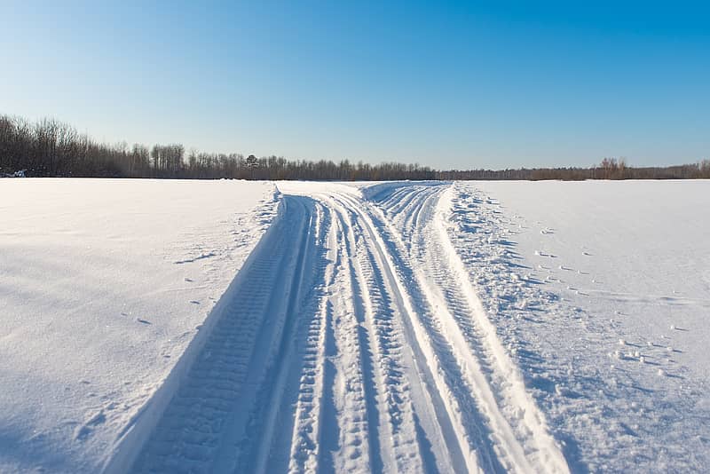 snowmobile trail in winter scenery