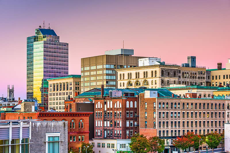 downtown skyline of Worcester, Massachusetts at sunset with a pink sky