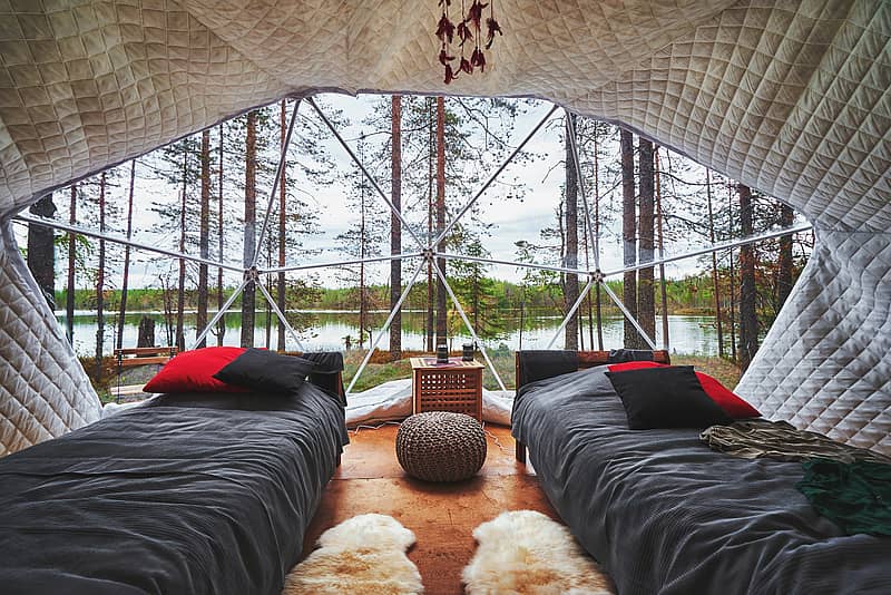 inside a luxury glamping pod overlooking the wilderness and water