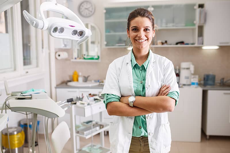 woman dentist standing in office