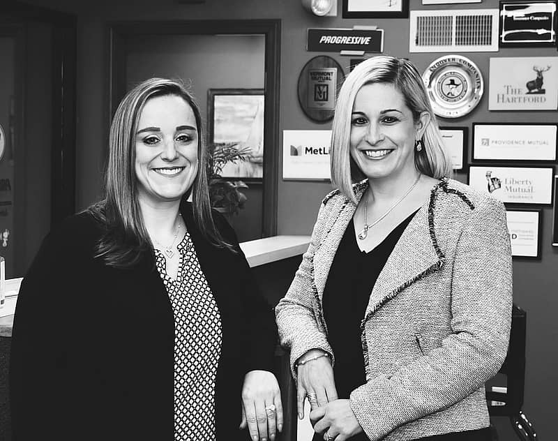 two women standing in an office