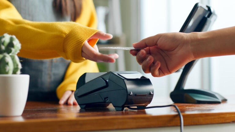 cashier accepting payment from a patron