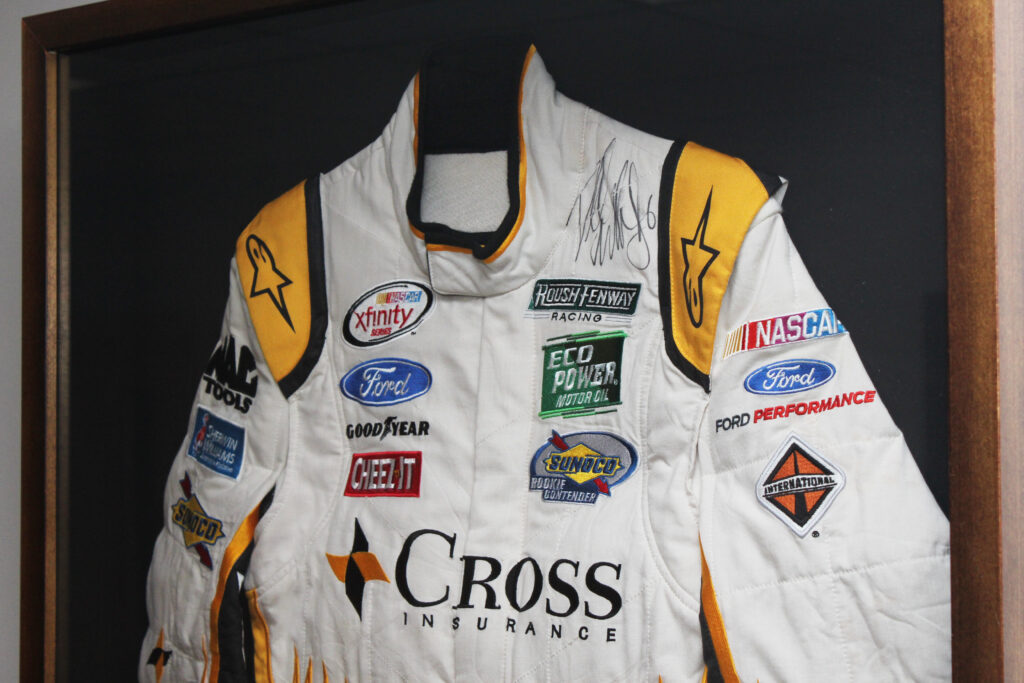 close up of professionally framed autographed bubba wallace racing jumpsuit