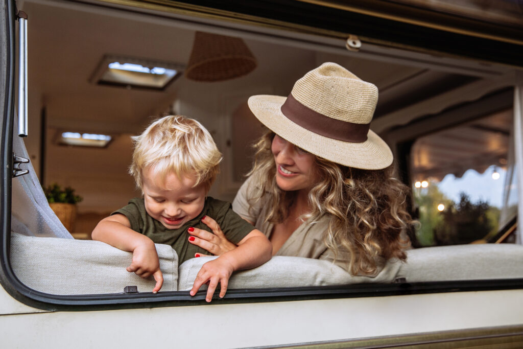 parent and child having fun in motorhome